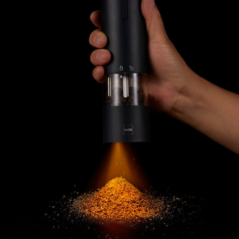 Electric stainless steel salt and pepper grinder with one-touch operation for quick and effortless seasoning.